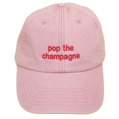 Dusky pink Vintage Cap mit roter Stickerei „pop the champagne“ oben