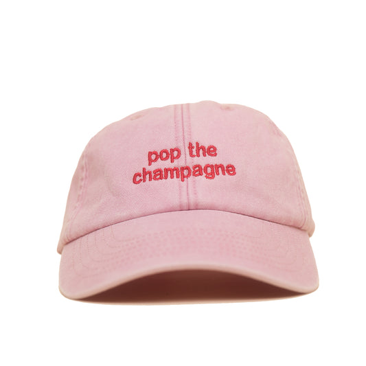 Dusky pink Vintage Cap mit roter Stickerei „pop the champagne“ frontal